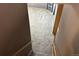 Carpeted stairs with a wooden banister lead to a lower level at 3613 S Olathe St, Aurora, CO 80013