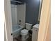 Cozy full bathroom with a tub, toilet, and white vanity, ideal for relaxation at 3613 S Olathe St, Aurora, CO 80013