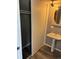 Bathroom featuring a pedestal sink, closet and updated fixtures at 3613 S Olathe St, Aurora, CO 80013