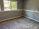 Bedroom with a window and neutral carpet, offering a peaceful retreat at 3613 S Olathe St, Aurora, CO 80013