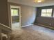 Versatile room featuring windows and connecting spaces at 3613 S Olathe St, Aurora, CO 80013