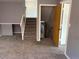 Neutral-toned carpeted stairs lead to various rooms and levels at 3613 S Olathe St, Aurora, CO 80013