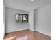 Bedroom boasts wood floors, a window for natural light, and neutral walls at 7995 E Mississippi Ave # C1, Denver, CO 80247
