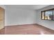 Bedroom with wood floor and window for natural light, creating an inviting space at 7995 E Mississippi Ave # C1, Denver, CO 80247