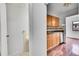 Kitchen featuring wood cabinets and stainless steel dishwasher at 7995 E Mississippi Ave # C1, Denver, CO 80247