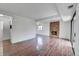 Spacious living room featuring sleek floors, a brick fireplace, and natural light at 7995 E Mississippi Ave # C1, Denver, CO 80247