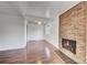 Cozy living room with hardwood floors and brick fireplace at 7995 E Mississippi Ave # C1, Denver, CO 80247