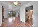 Open floor plan featuring fireplace and view to kitchen at 7995 E Mississippi Ave # C1, Denver, CO 80247