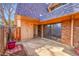 Private patio featuring brick accents, wood fence, and convenient access to sliding glass doors at 7995 E Mississippi Ave # C1, Denver, CO 80247