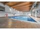 Indoor pool area features tile flooring, windows, and a lifeguard for safety at 7995 E Mississippi Ave # C1, Denver, CO 80247