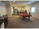 Finished basement with kitchenette, pool table, bar and entertainment area at 5204 Lake Port Ave, Longmont, CO 80504