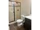 Modern bathroom featuring a glass-enclosed shower with sleek fixtures and white ceramic tiles at 5204 Lake Port Ave, Longmont, CO 80504