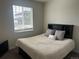 Inviting bedroom with a comfortable bed and ample natural light at 5204 Lake Port Ave, Longmont, CO 80504
