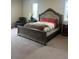 Bedroom with luxurious bed, carpet, and matching night stands at 5204 Lake Port Ave, Longmont, CO 80504