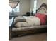 Bedroom with luxurious bed, carpet, and matching night stands at 5204 Lake Port Ave, Longmont, CO 80504