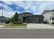 Charming single-Gathering home with a three-car garage, manicured lawn, and tasteful stone accents at 5204 Lake Port Ave, Longmont, CO 80504