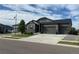 Single-Gathering home boasts three-car garage, appealing stone accents, and manicured landscaping at 5204 Lake Port Ave, Longmont, CO 80504