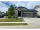 Attractive single-Gathering home featuring a three-car garage and a well-maintained front yard at 5204 Lake Port Ave, Longmont, CO 80504