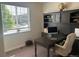 A well-lit office features a built-in desk and shelving at 5204 Lake Port Ave, Longmont, CO 80504