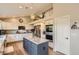 Well-lit kitchen boasting granite countertops, stainless appliances, and hardwood floors at 9229 Sugarstone Cir, Highlands Ranch, CO 80130
