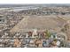 Aerial view of the home with a view of the city skyline in the background at 3540 E 90Th Pl, Thornton, CO 80229