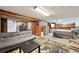 View of the finished basement featuring a seating area and bedroom at 3540 E 90Th Pl, Thornton, CO 80229