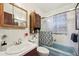 Cozy full bathroom features a bath tub with shower, vanity sink and a medicine cabinet at 3540 E 90Th Pl, Thornton, CO 80229
