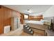 Basement bedroom with light wood paneling, and large windows at 3540 E 90Th Pl, Thornton, CO 80229