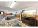 Finished basement bedroom area includes a bed, dresser, and television at 3540 E 90Th Pl, Thornton, CO 80229