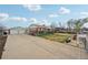 Property featuring a spacious driveway and well-kept lawn enhancing curb appeal at 3540 E 90Th Pl, Thornton, CO 80229