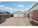 Two car garage with white doors with brick facade at 3540 E 90Th Pl, Thornton, CO 80229