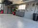 Well-organized garage featuring built-in storage and epoxy flooring at 3540 E 90Th Pl, Thornton, CO 80229