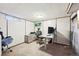 Finished basement office space features a desk, chair and shelving at 3540 E 90Th Pl, Thornton, CO 80229