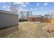 Spacious backyard with a well-maintained lawn, brick house, and storage shed, great for outdoor enjoyment at 1610 Trenton St, Denver, CO 80220