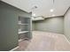 Finished basement with carpeting, recessed lighting, and built-in shelving at 1610 Trenton St, Denver, CO 80220