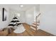 Bright bonus room with a black and white play tent and wood-look floors at 1610 Trenton St, Denver, CO 80220