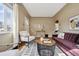 Bright living room with hardwood floors, white curtains, and a modern rug at 1610 Trenton St, Denver, CO 80220