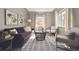 Bright living room featuring hardwood floors, neutral paint, and modern furnishings at 1610 Trenton St, Denver, CO 80220