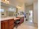 Elegant bathroom with double vanity, custom cabinets, and decorative lighting at 4971 Bross Pl, Broomfield, CO 80023