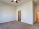 Bright bedroom featuring a ceiling fan and a walk-in closet at 4971 Bross Pl, Broomfield, CO 80023