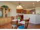 Cozy breakfast nook with wooden table and a view of the kitchen at 4971 Bross Pl, Broomfield, CO 80023