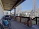 Outdoor deck with a dining table and backyard views at 4971 Bross Pl, Broomfield, CO 80023