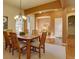 Formal dining room featuring hardwood floors, an elegant chandelier, and wainscoting at 4971 Bross Pl, Broomfield, CO 80023