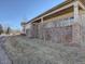 Landscaped front yard with covered porch at 4971 Bross Pl, Broomfield, CO 80023