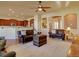 Open-concept living room with hardwood floors and views into the kitchen at 4971 Bross Pl, Broomfield, CO 80023