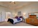 Bright main bedroom with closet, ensuite bathroom, and neutral wall color at 4971 Bross Pl, Broomfield, CO 80023