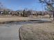 Scenic view of the neighborhood showing paved walking path, mature trees, and well-manicured lawns at 4971 Bross Pl, Broomfield, CO 80023