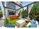 Backyard patio with pergola, seating, hot tub, artificial turf, and modern design at 2242 W 34Th Ave, Denver, CO 80211