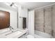 Bright bathroom featuring a modern vanity, tiled shower-tub combo, and neutral color palette at 2242 W 34Th Ave, Denver, CO 80211