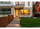Modern home exterior with landscaped yard, stepping stone pathway, and contemporary design at 2242 W 34Th Ave, Denver, CO 80211